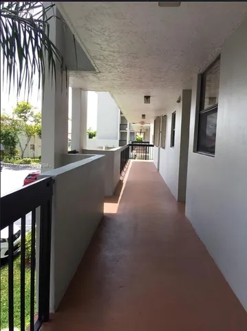 a view of a porch and garden