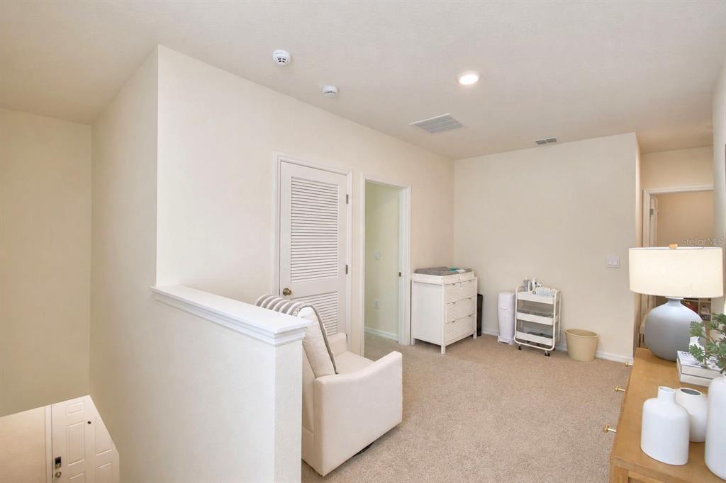 2839 Moulin Road Davenport, FL 33837 - Photo 27 of 75 a living room with furniture and a window