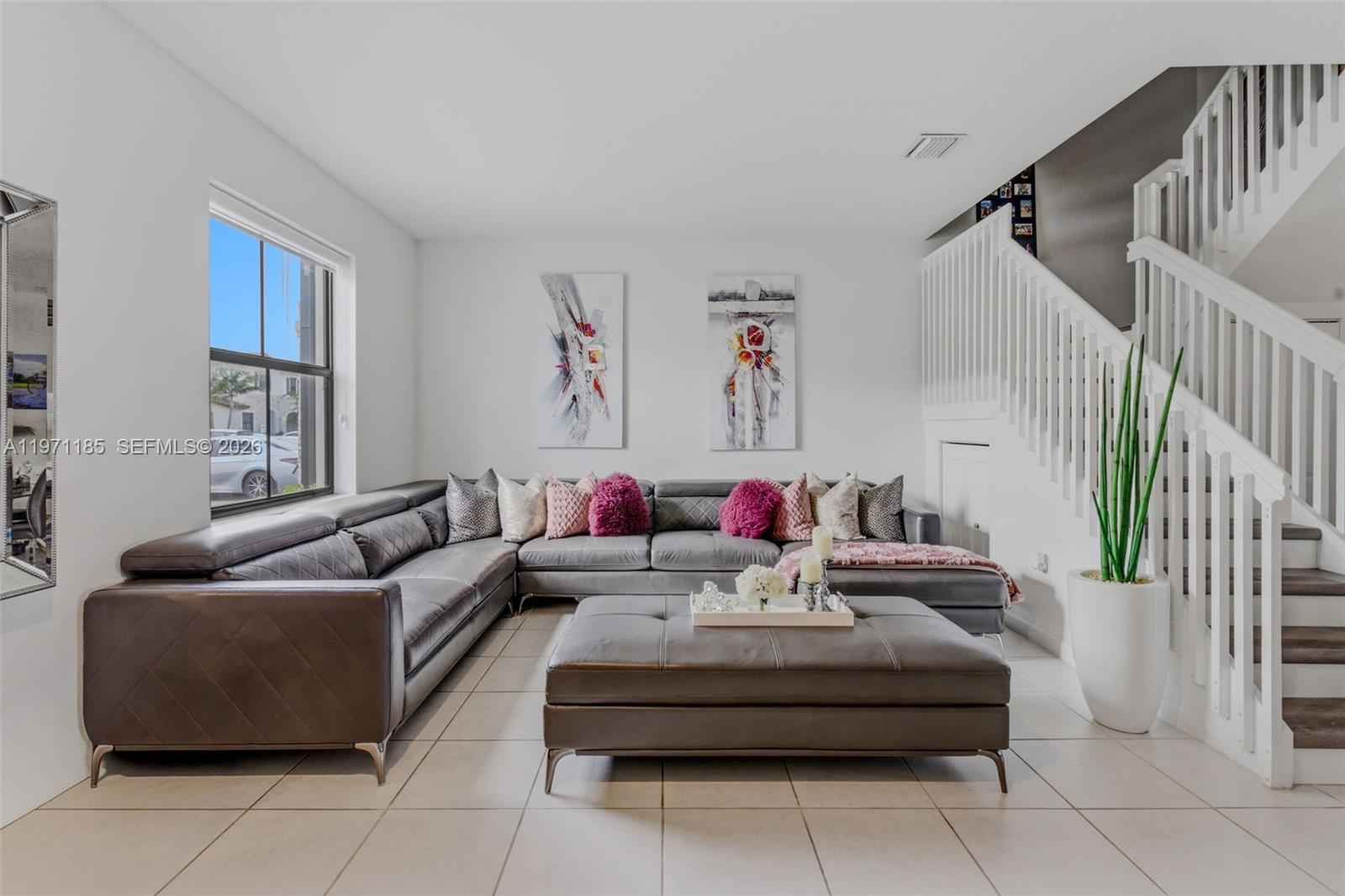 a living room with furniture and a couch
