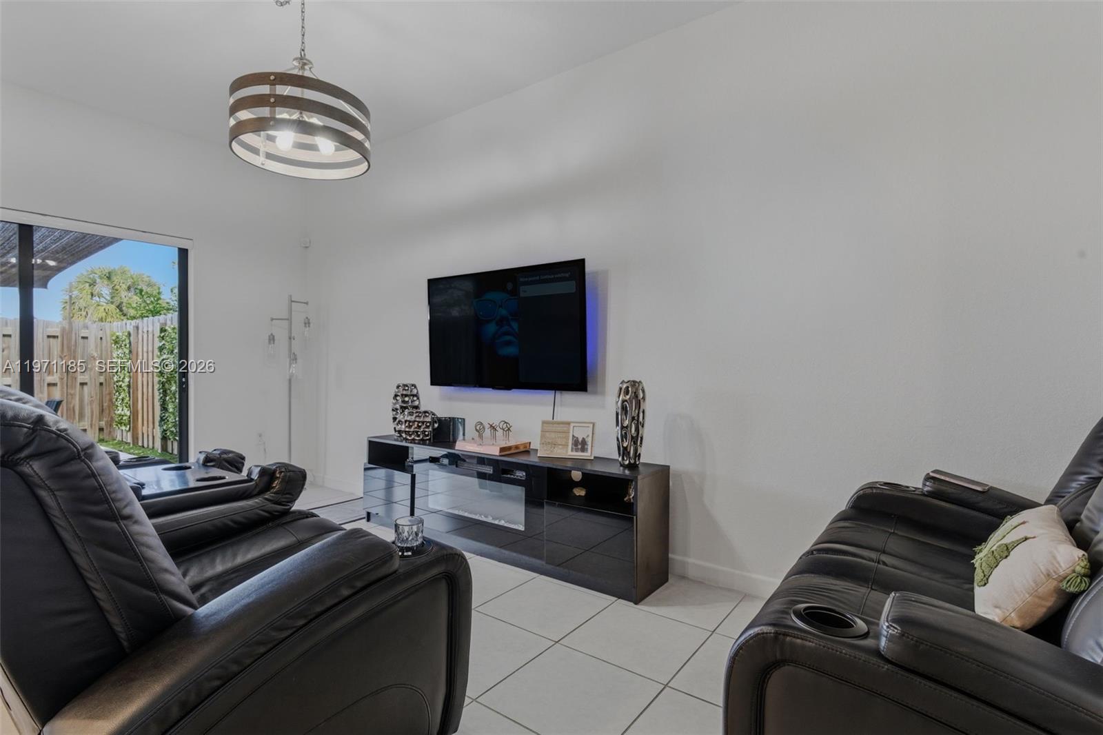 10009 Southwest 228th Terrace Miami, FL 33190 - Photo 11 of 48 a living room with furniture