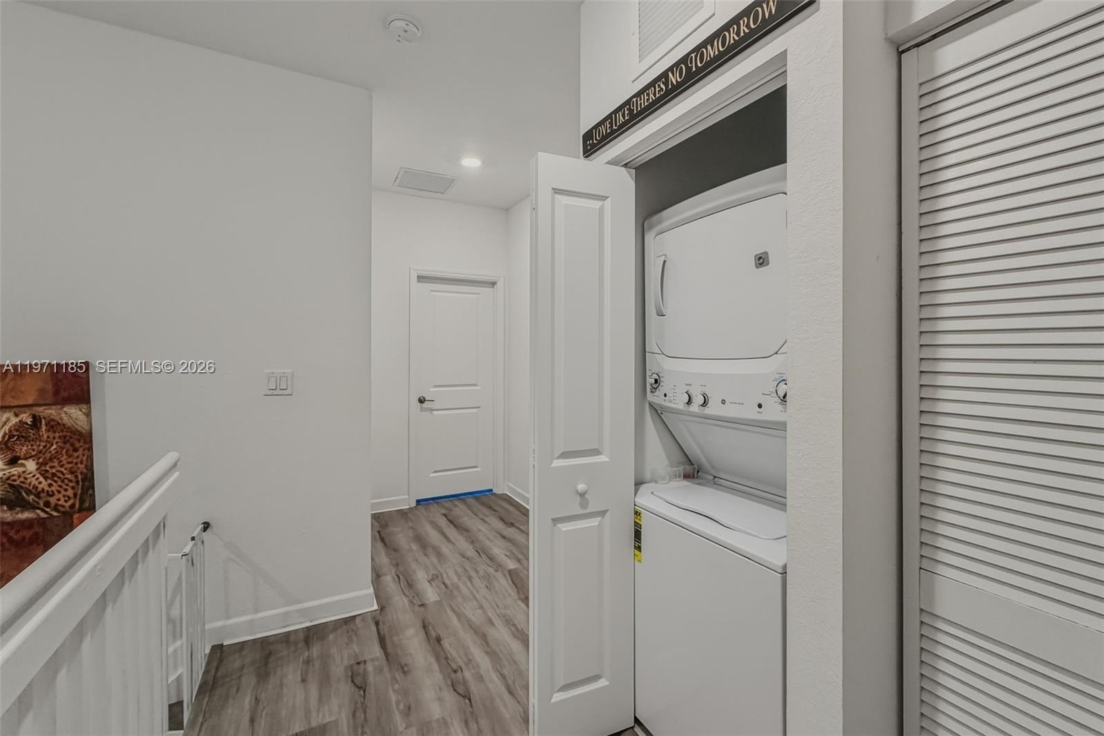 10009 Southwest 228th Terrace Miami, FL 33190 - Photo 15 of 48 a room with a washer and dryer