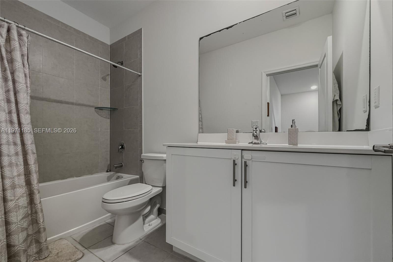 10009 Southwest 228th Terrace Miami, FL 33190 - Photo 28 of 48 a bathroom with a sink toilet and shower