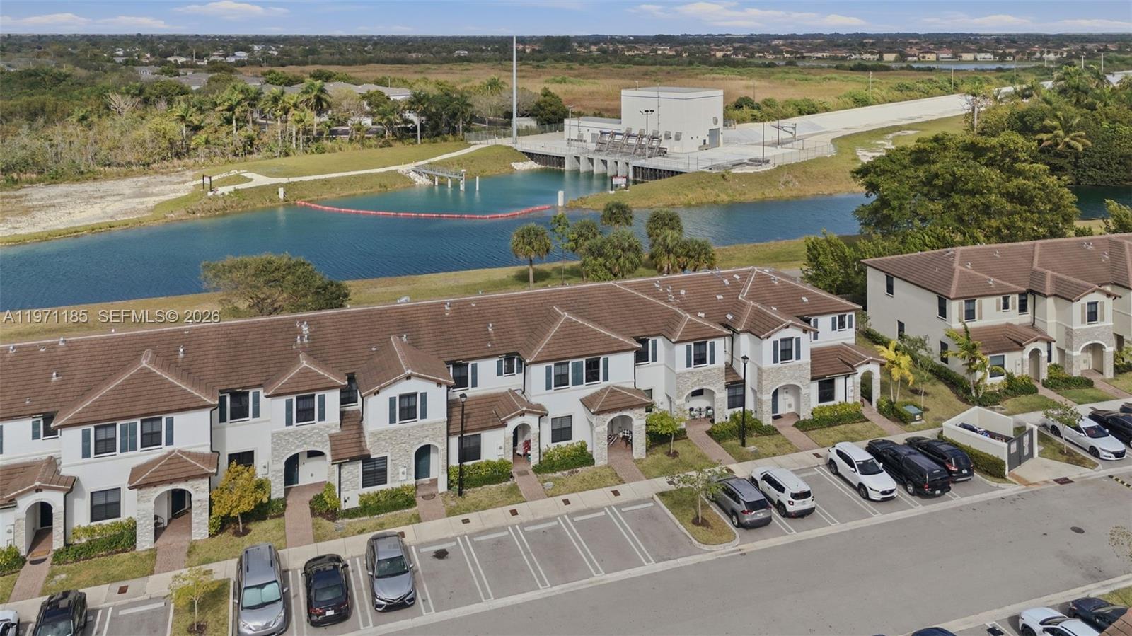 10009 Southwest 228th Terrace Miami, FL 33190 - Photo 36 of 48 a view of building with ocean view