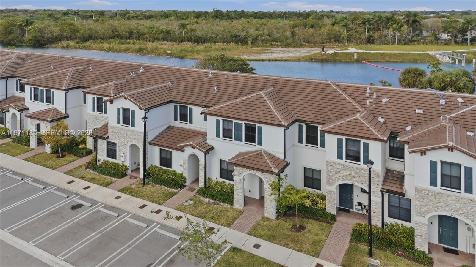 10009 Southwest 228th Terrace Miami, FL 33190 - Photo 38 of 48 an aerial view of a house with a yard