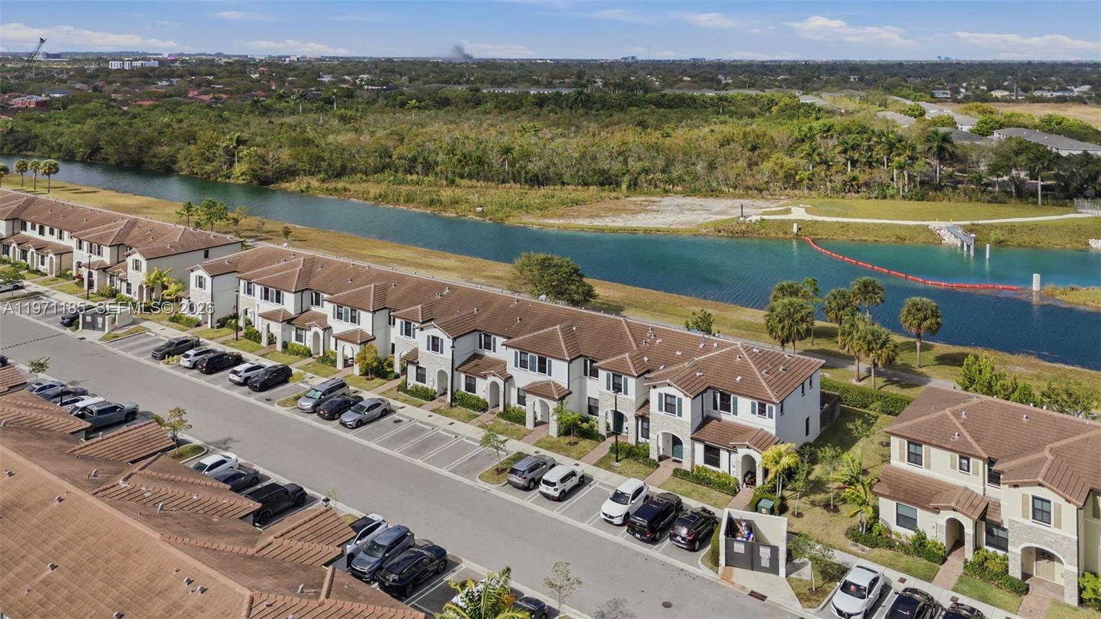 10009 Southwest 228th Terrace Miami, FL 33190 - Photo 40 of 48 an aerial view of a house with a lake view