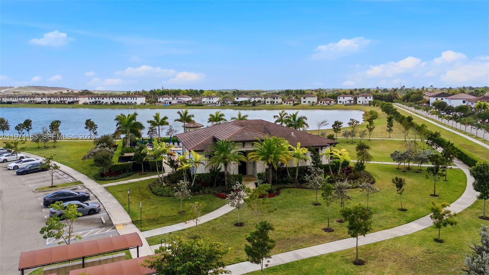 10009 Southwest 228th Terrace Miami, FL 33190 - Photo 42 of 48 an aerial view of a residential houses with outdoor space and lake view