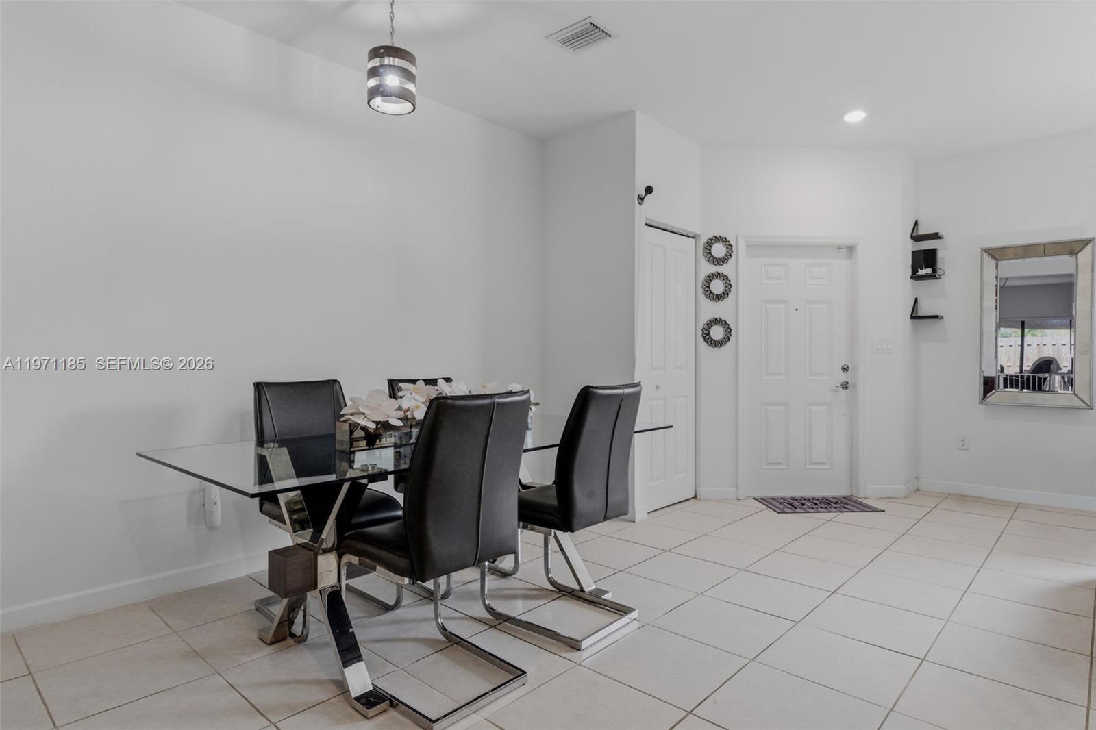 10009 Southwest 228th Terrace Miami, FL 33190 - Photo 6 of 48 a view of a workspace with furniture