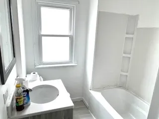 a kitchen with a sink and a refrigerator