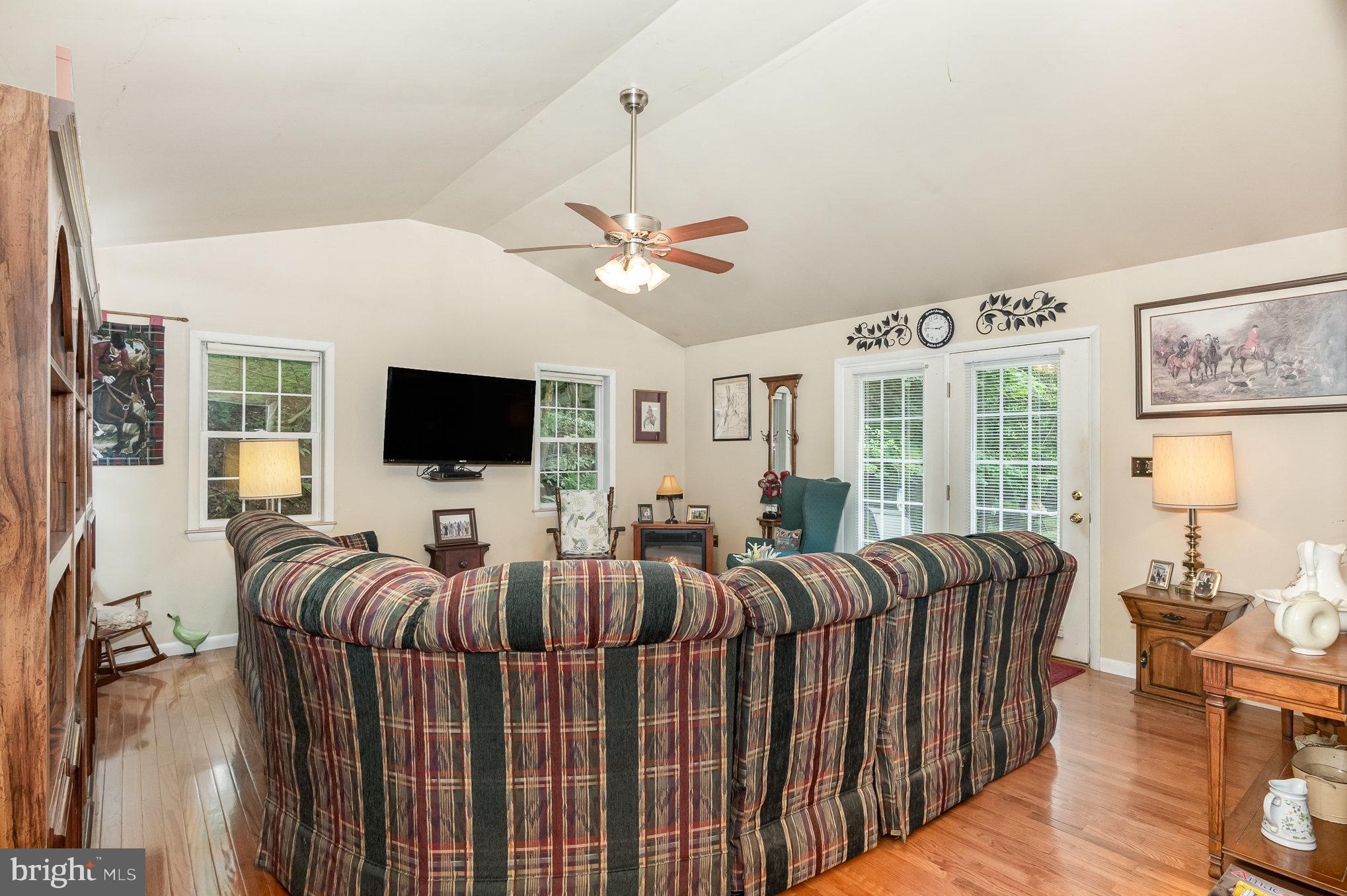 417 Ray Mar Road Oxford, PA 19363 - Photo 13 of 34 a living room with furniture a ceiling fan and a flat screen tv