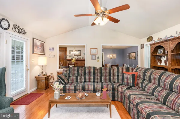a bedroom with a bed and a lamp on the dresser