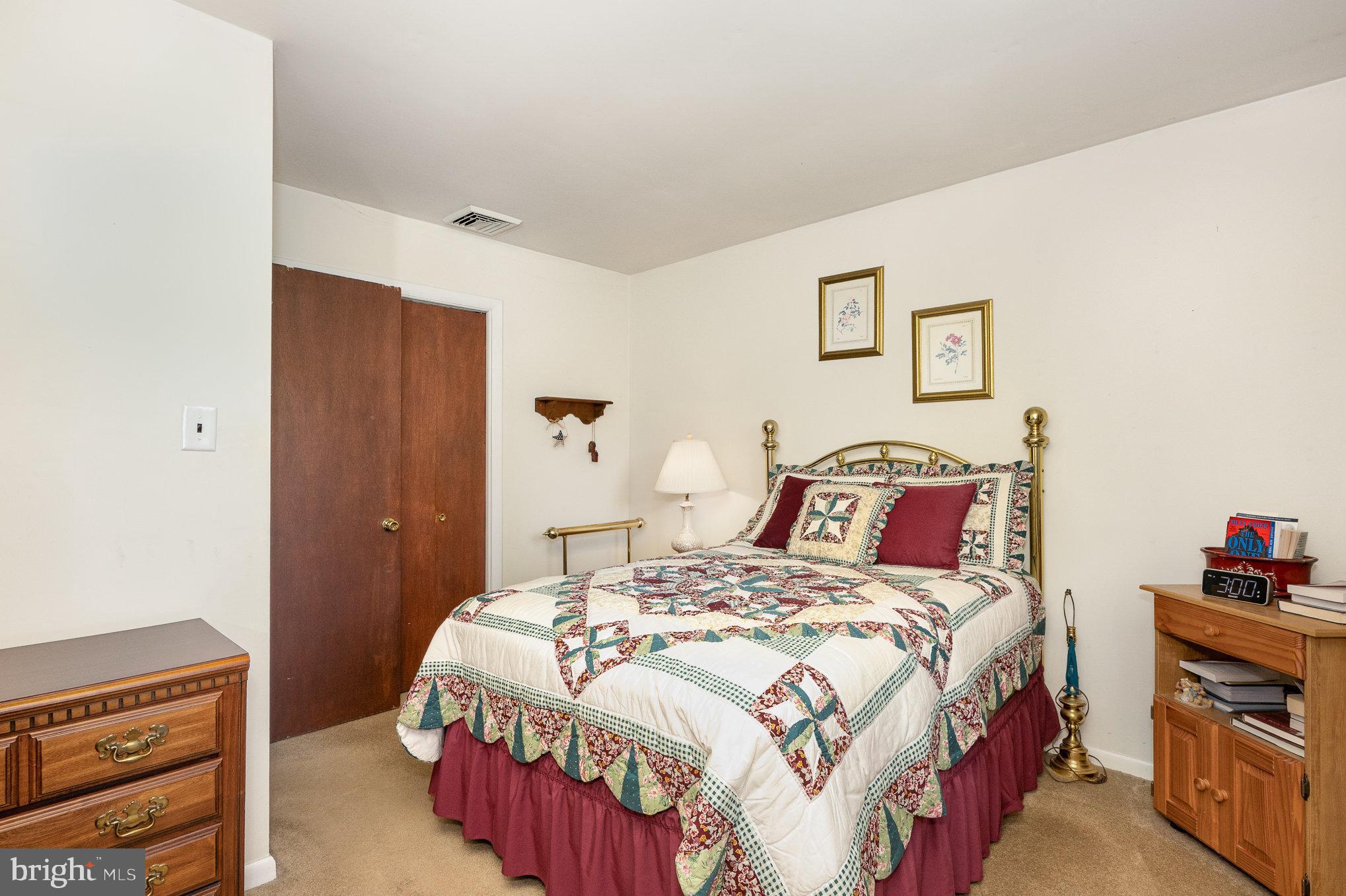 417 Ray Mar Road Oxford, PA 19363 - Photo 17 of 34 a bedroom with a bed and a lamp on the dresser