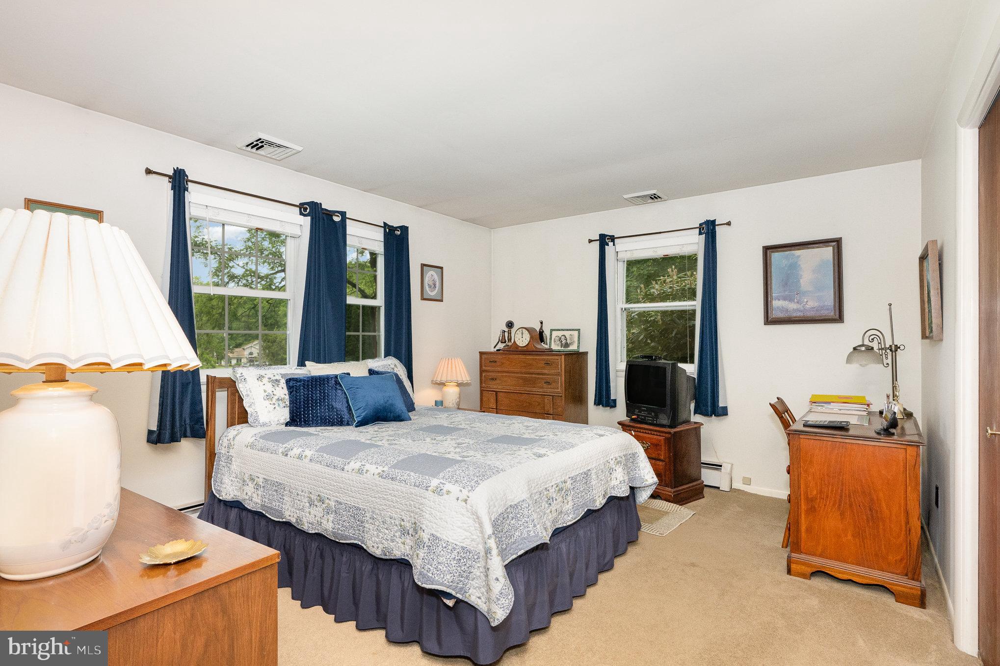 417 Ray Mar Road Oxford, PA 19363 - Photo 18 of 34 a bedroom with a bed and wooden floor