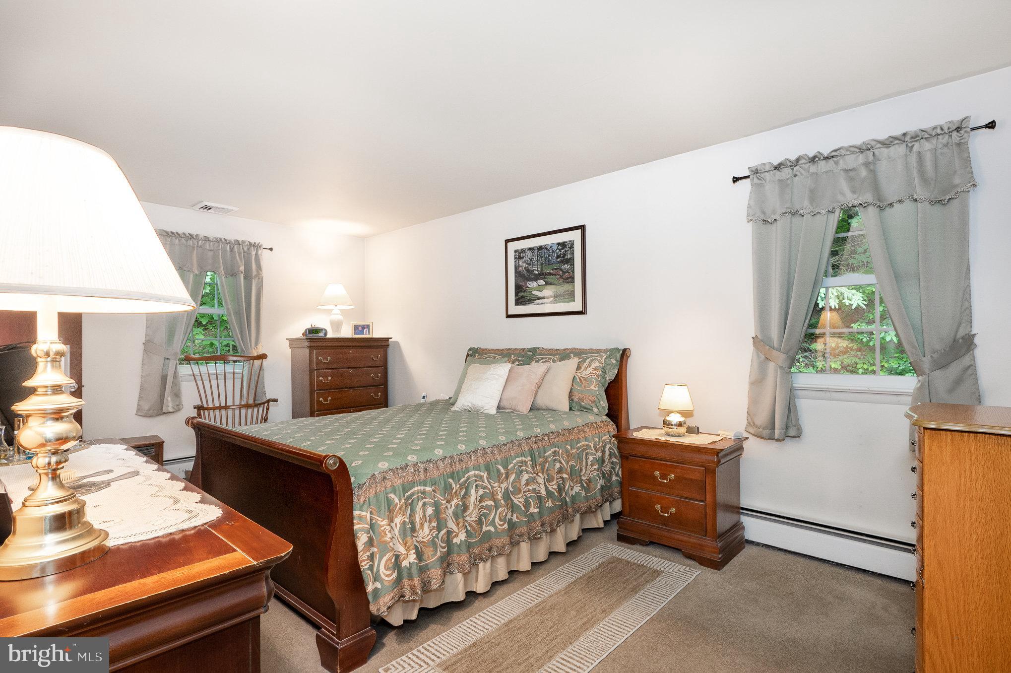 417 Ray Mar Road Oxford, PA 19363 - Photo 21 of 34 a bedroom with a bed and a table