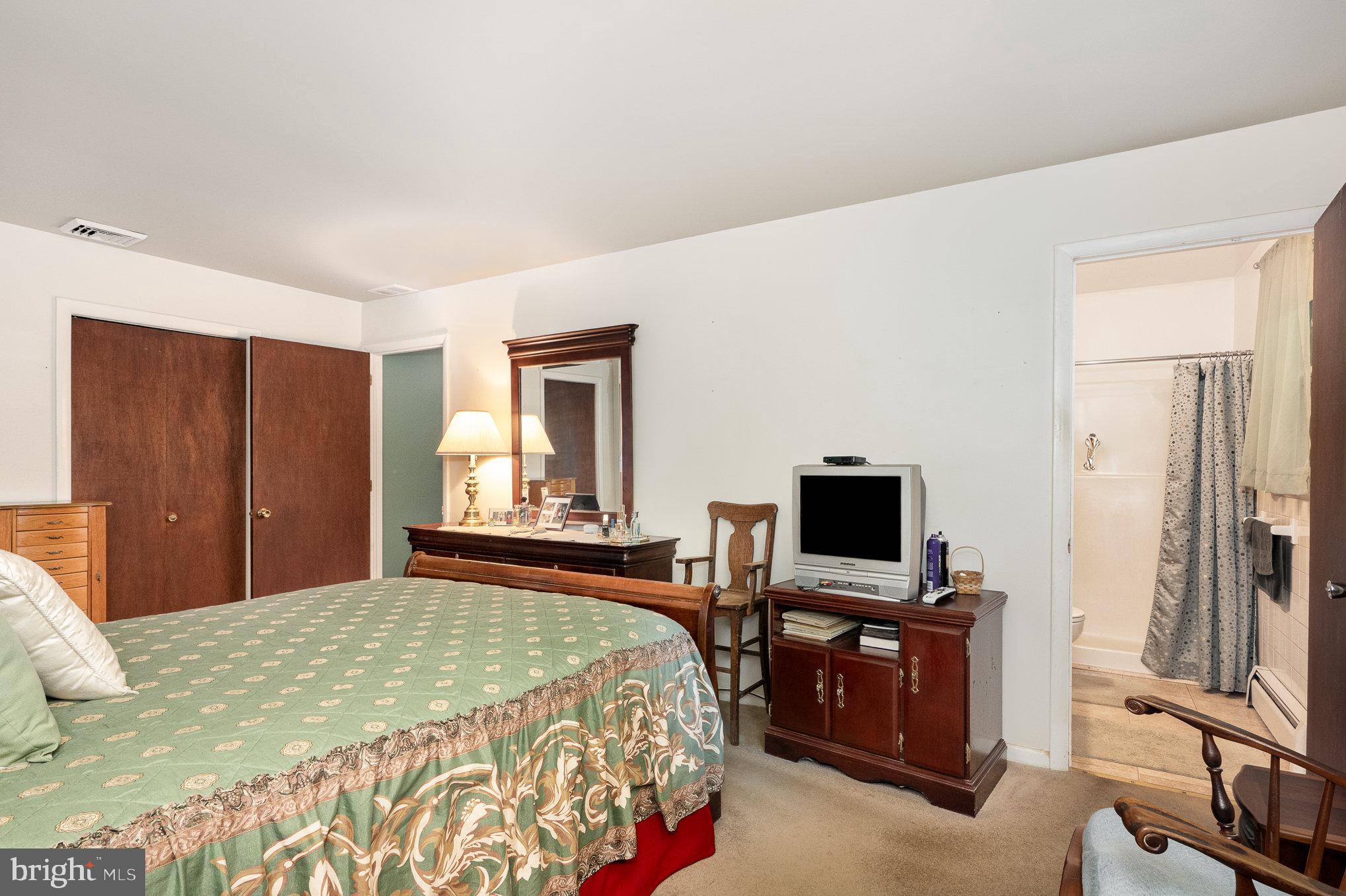 417 Ray Mar Road Oxford, PA 19363 - Photo 22 of 34 a bedroom with a bed and a television