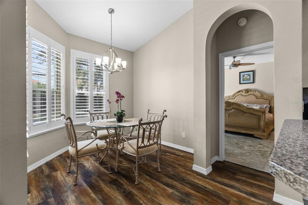 14624 Kitlanselt Way Orlando, FL 32828 - Photo 19 of 42 a view of a livingroom with furniture window and wooden floor