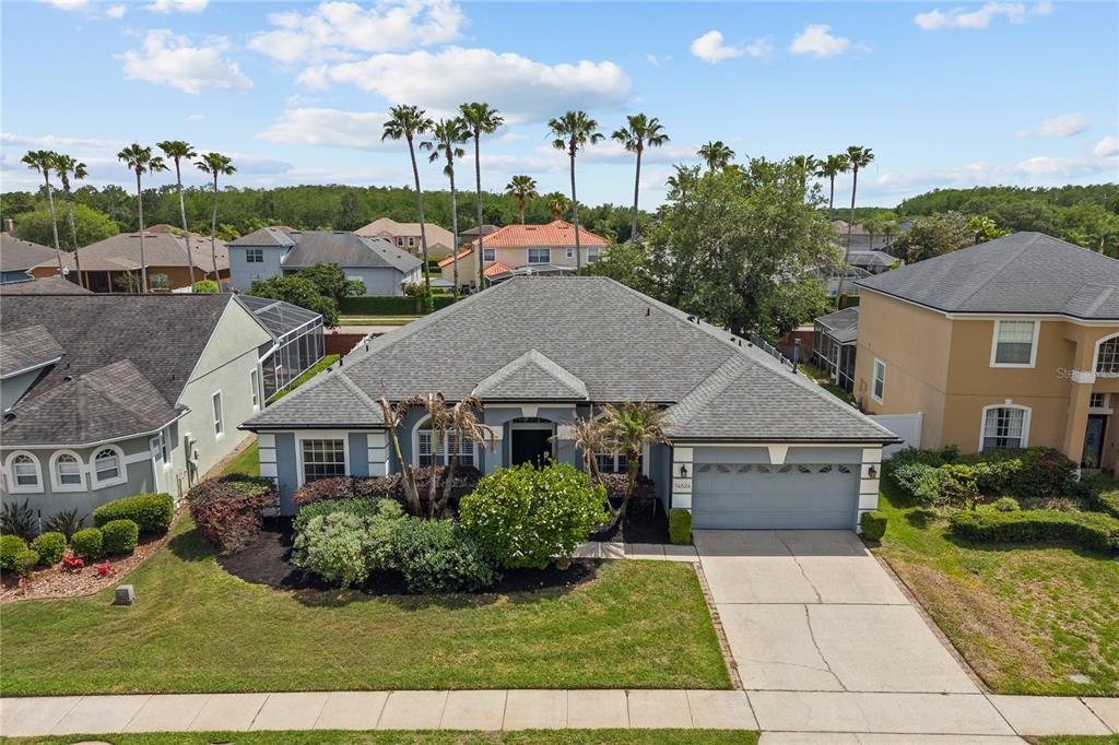 14624 Kitlanselt Way Orlando, FL 32828 - Photo 2 of 42 a house view with a garden space