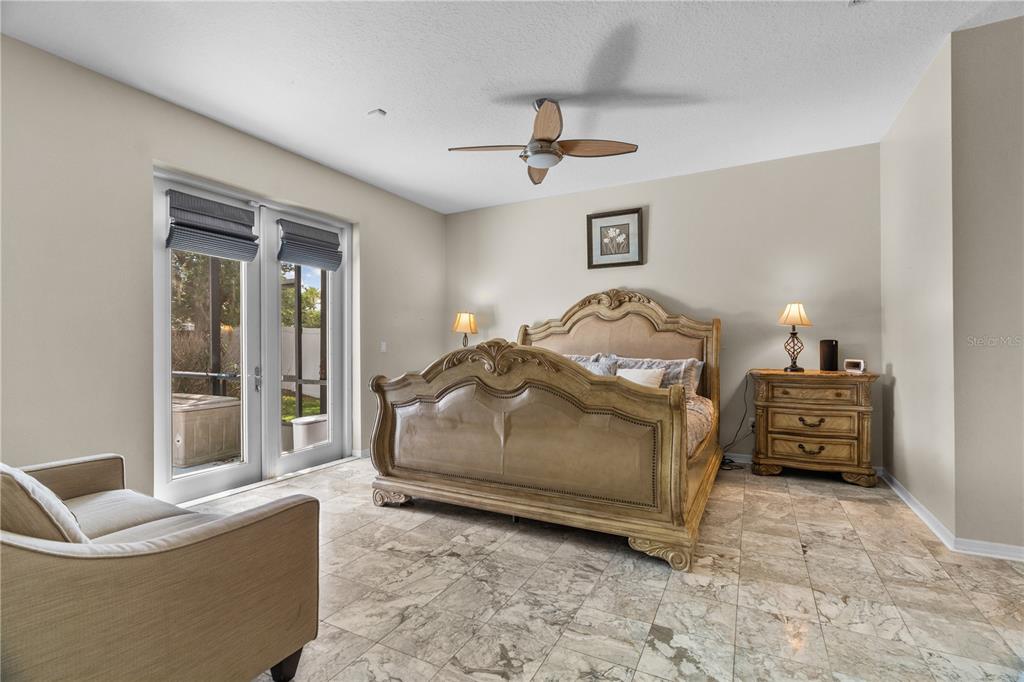 14624 Kitlanselt Way Orlando, FL 32828 - Photo 21 of 42 a bedroom with a bed and glass window