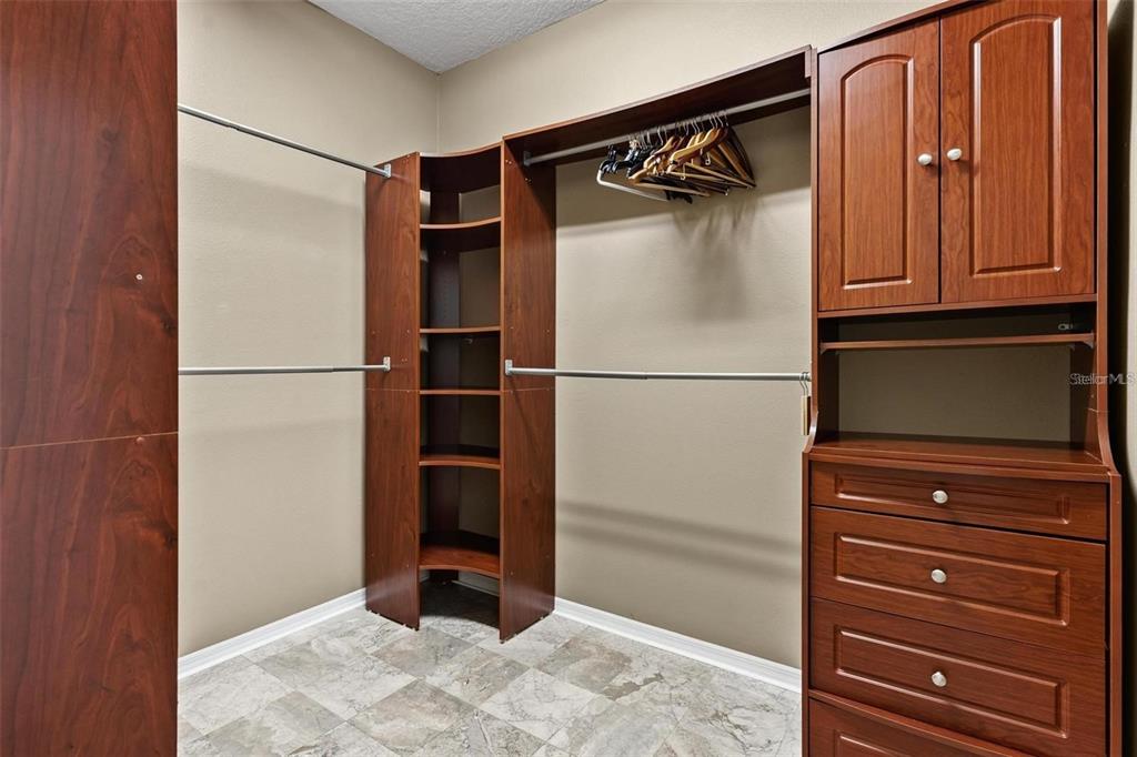 14624 Kitlanselt Way Orlando, FL 32828 - Photo 23 of 42 a view of walk in closet with empty racks