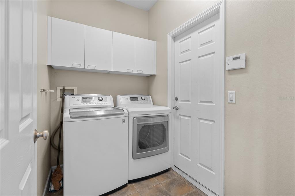 14624 Kitlanselt Way Orlando, FL 32828 - Photo 30 of 42 a utility room with dryer and washer