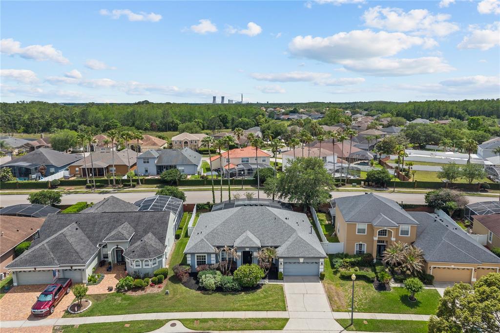 14624 Kitlanselt Way Orlando, FL 32828 - Photo 3 of 42 an aerial view of a house with a garden and lake view