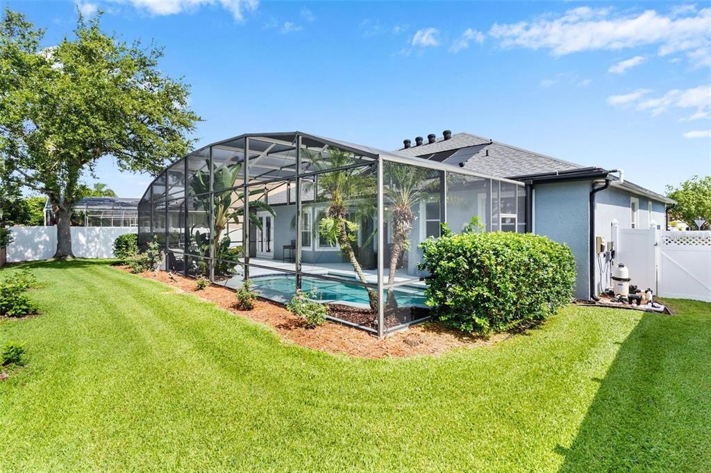 14624 Kitlanselt Way Orlando, FL 32828 - Photo 36 of 42 a view of a house with a yard