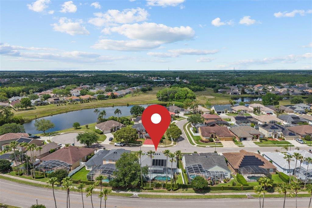 14624 Kitlanselt Way Orlando, FL 32828 - Photo 37 of 42 an aerial view of residential houses with outdoor space and lake view