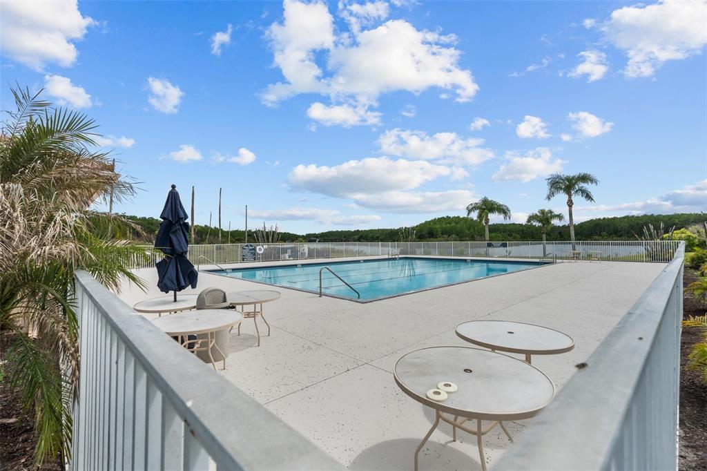 14624 Kitlanselt Way Orlando, FL 32828 - Photo 40 of 42 a view of a lake with a table and chairs