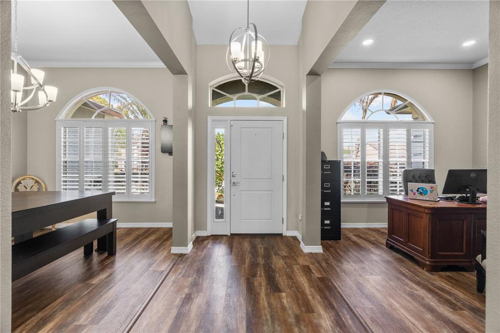 14624 Kitlanselt Way Orlando, FL 32828 - Photo 6 of 42 a view of a livingroom with furniture window and wooden floor