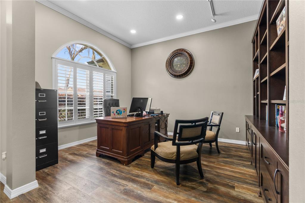 14624 Kitlanselt Way Orlando, FL 32828 - Photo 7 of 42 a view of a workspace with furniture and a window