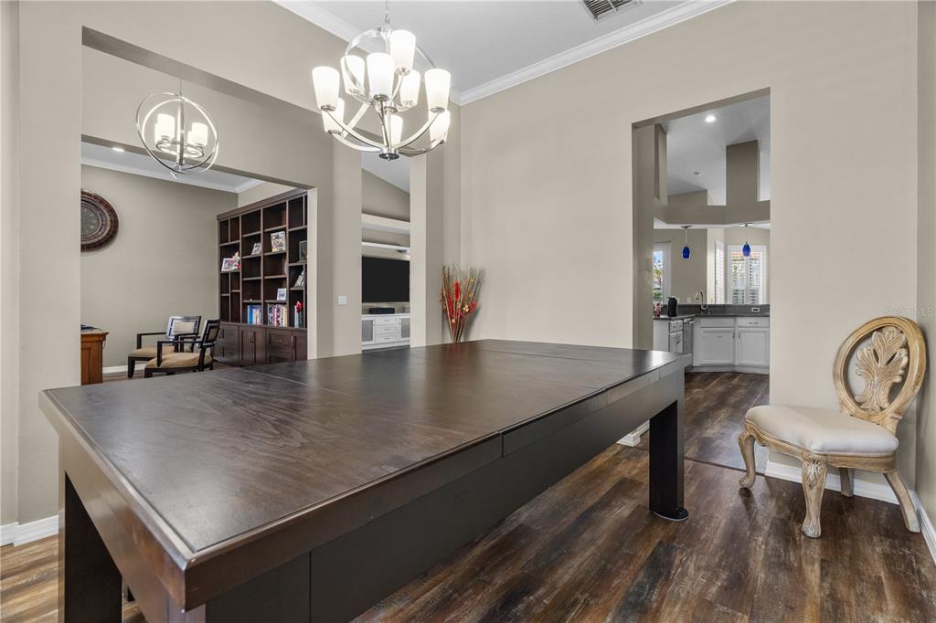 14624 Kitlanselt Way Orlando, FL 32828 - Photo 8 of 42 a view of a dining room with furniture and wooden floor