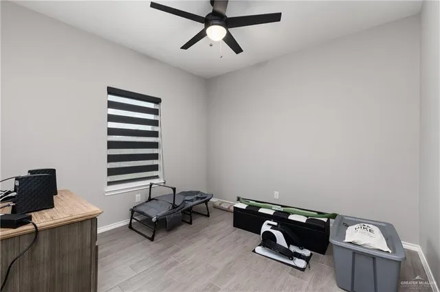 a living room with furniture a air conditioner and a window