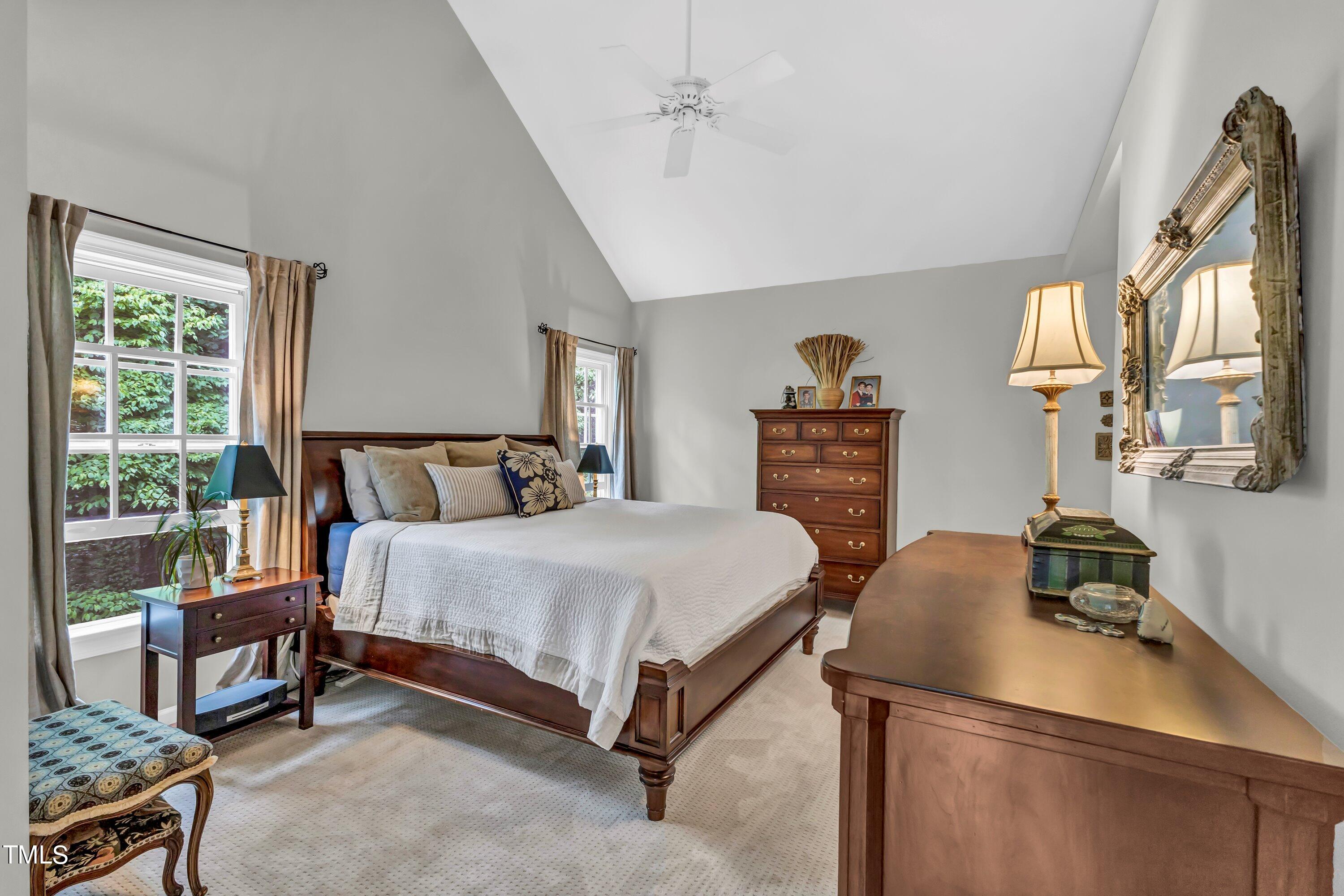 6105 Montcastle Court Raleigh, NC 27612 - Photo 24 of 44 a bedroom with a bed and wooden floor