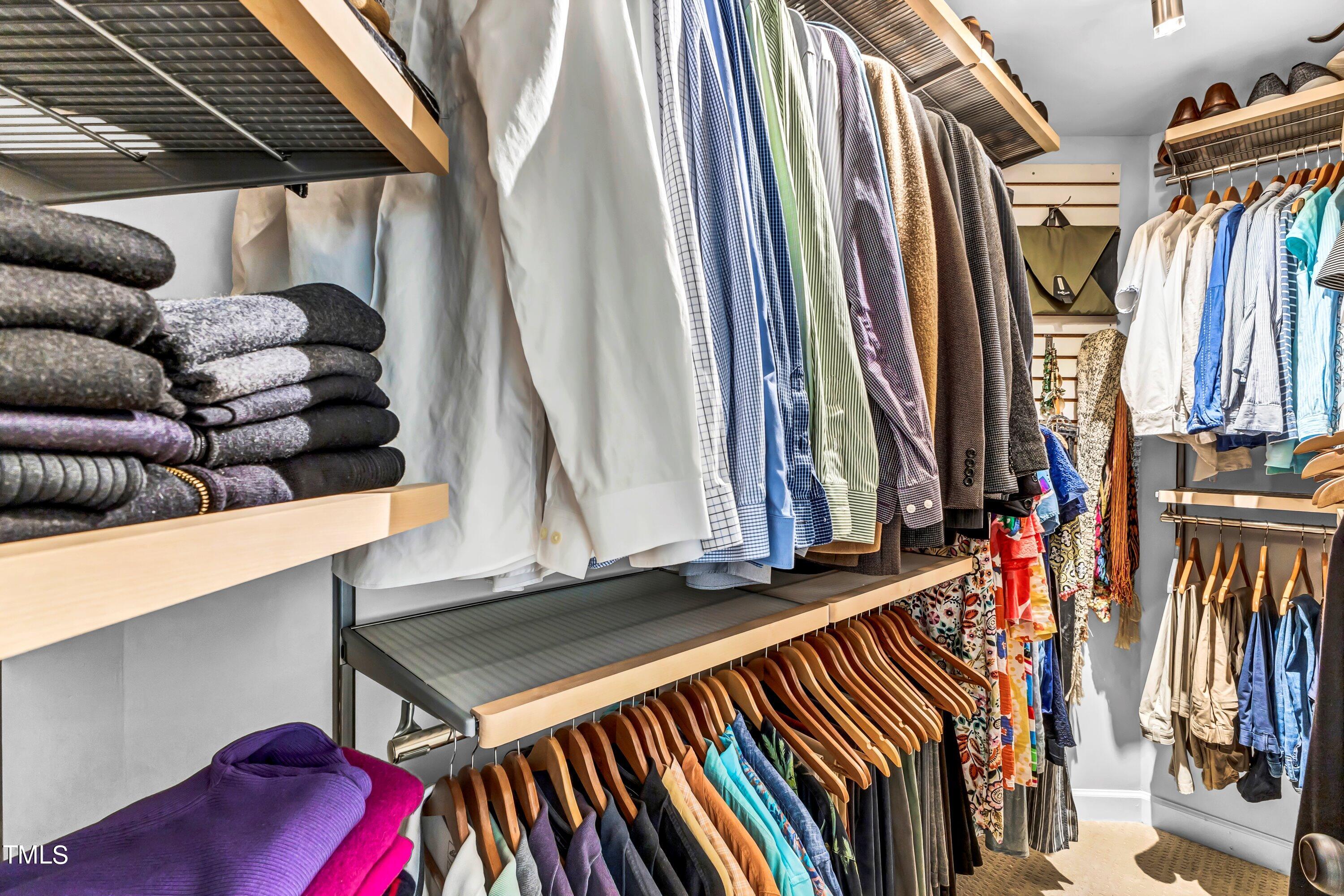 6105 Montcastle Court Raleigh, NC 27612 - Photo 27 of 44 a view of walk in closet with clothes and shoes