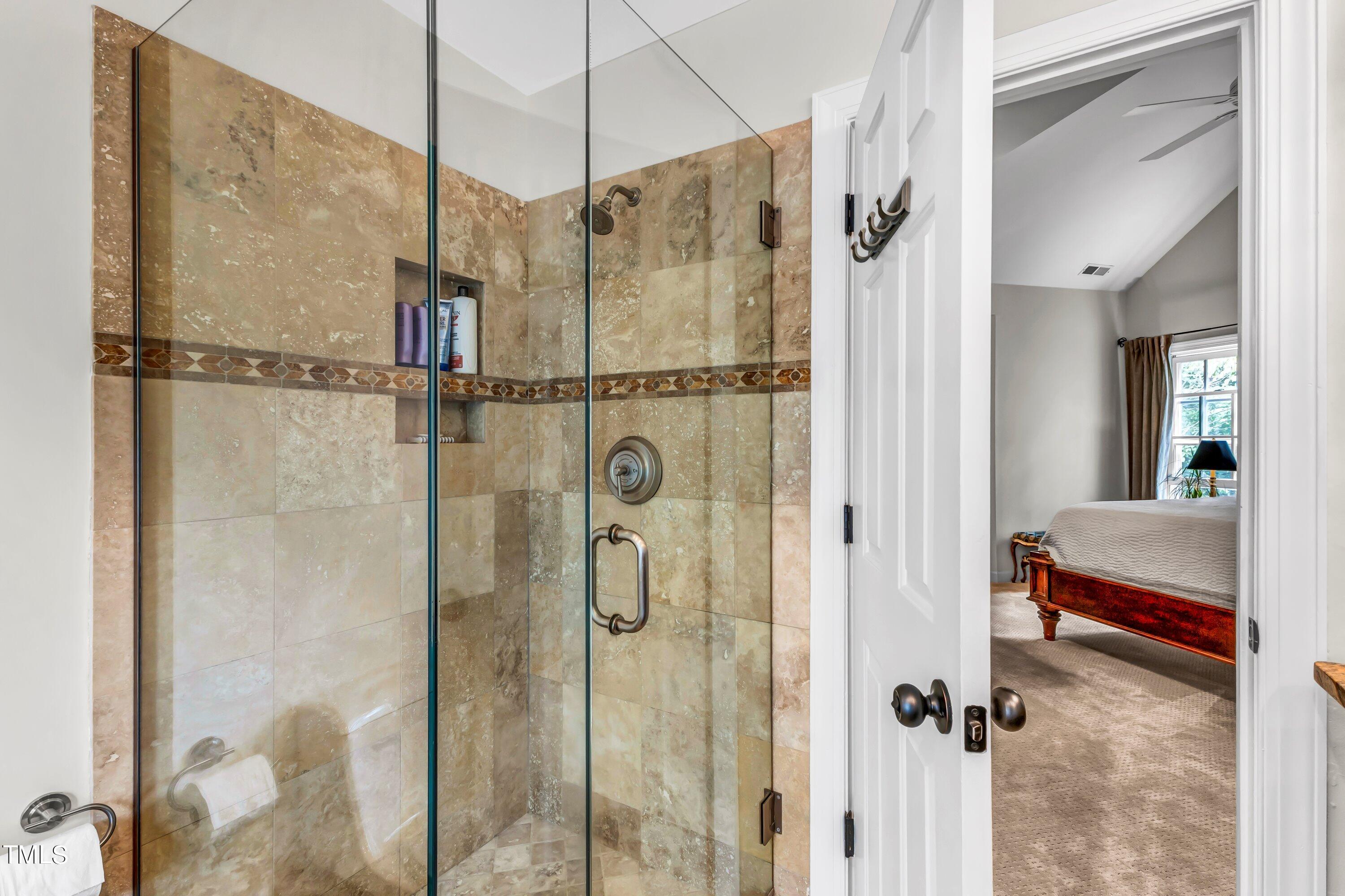 6105 Montcastle Court Raleigh, NC 27612 - Photo 30 of 44 a en suite bathroom with a shower