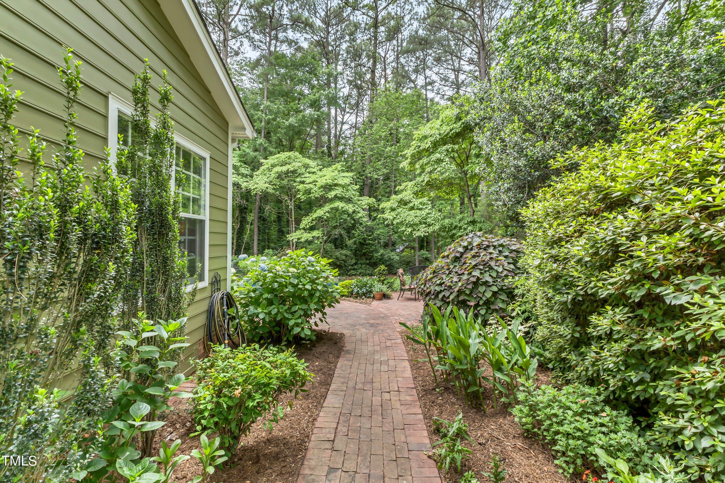 6105 Montcastle Court Raleigh, NC 27612 - Photo 38 of 44 a view of a garden