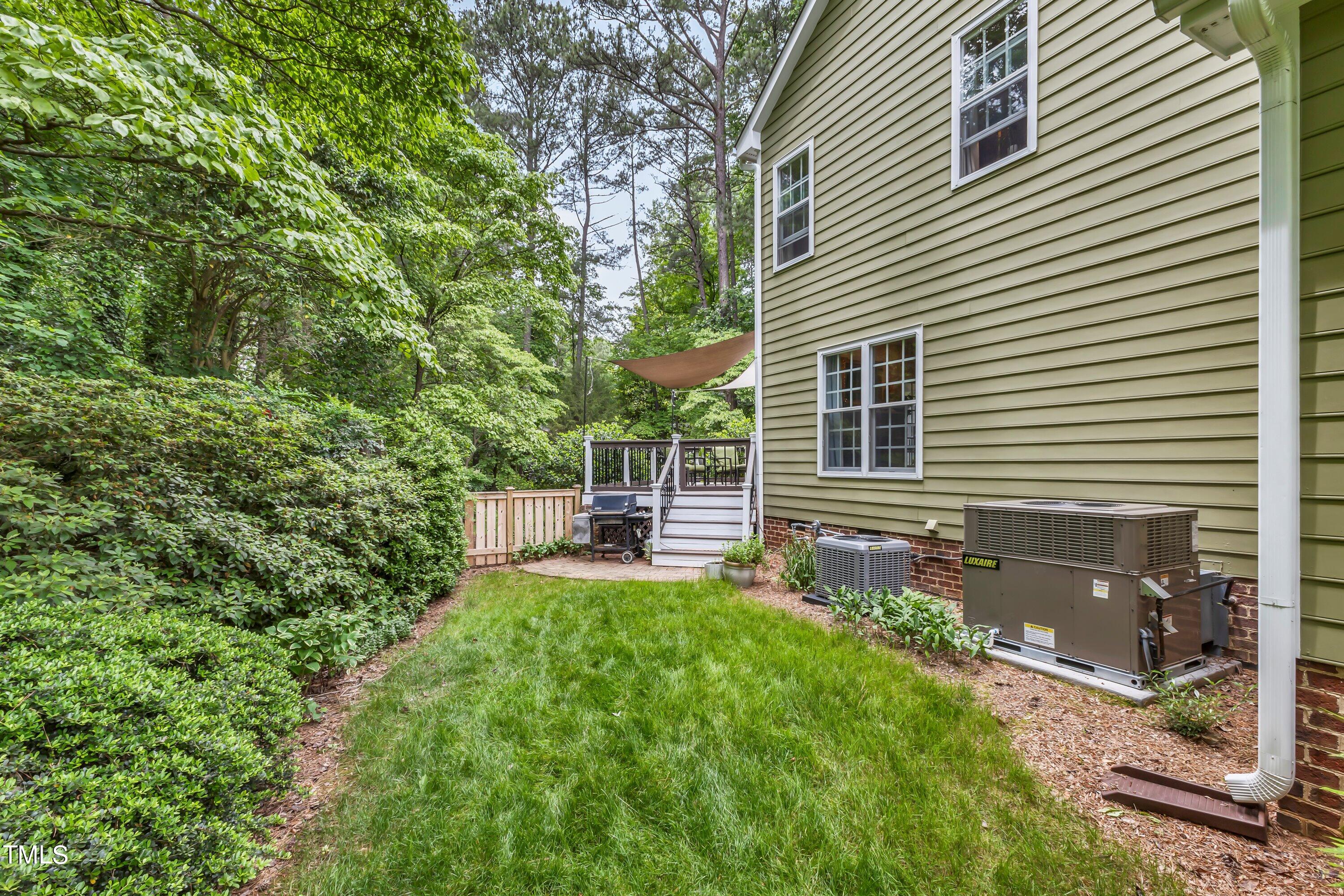 6105 Montcastle Court Raleigh, NC 27612 - Photo 41 of 44 a view of house with backyard