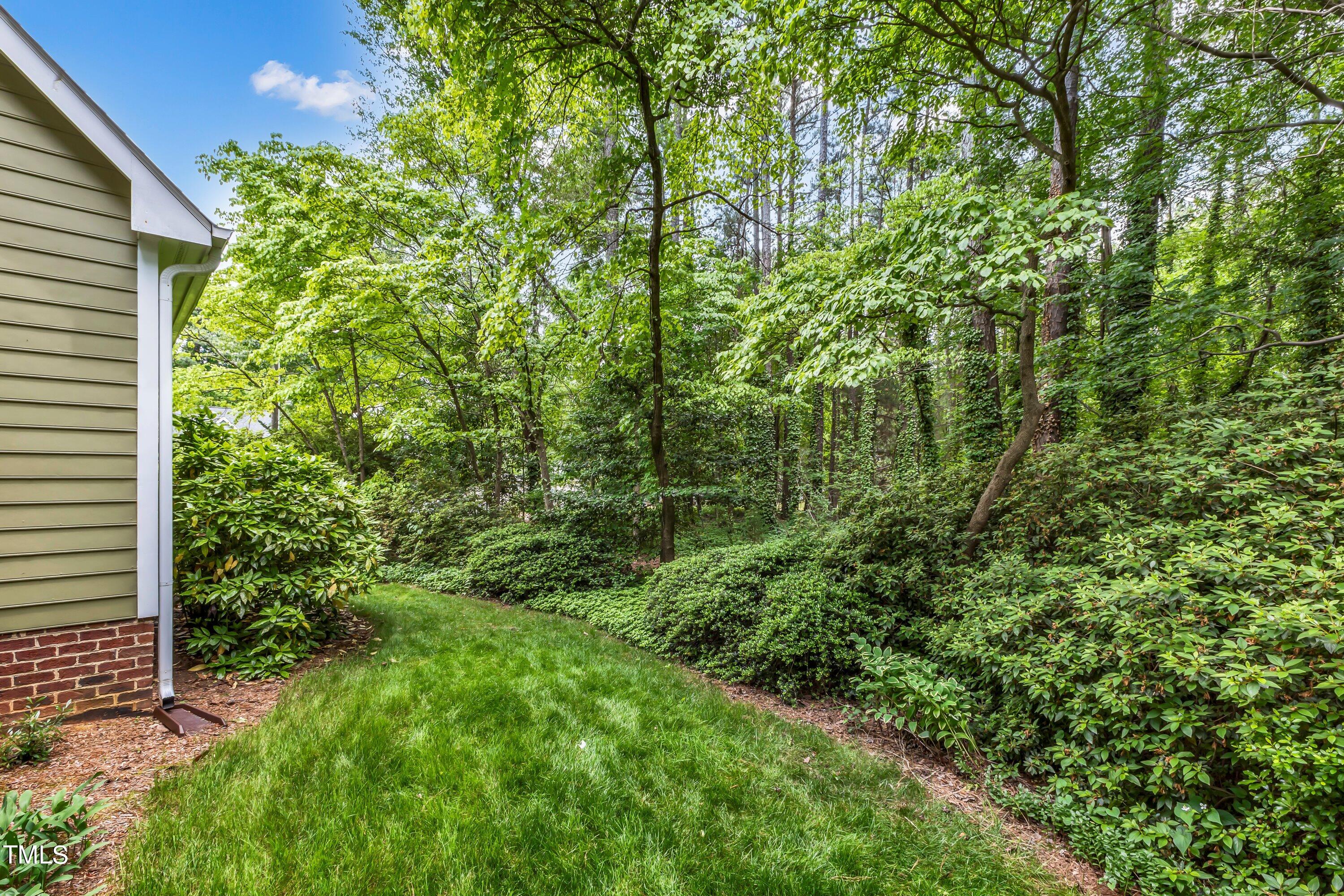 6105 Montcastle Court Raleigh, NC 27612 - Photo 42 of 44 a view of a house with a tree
