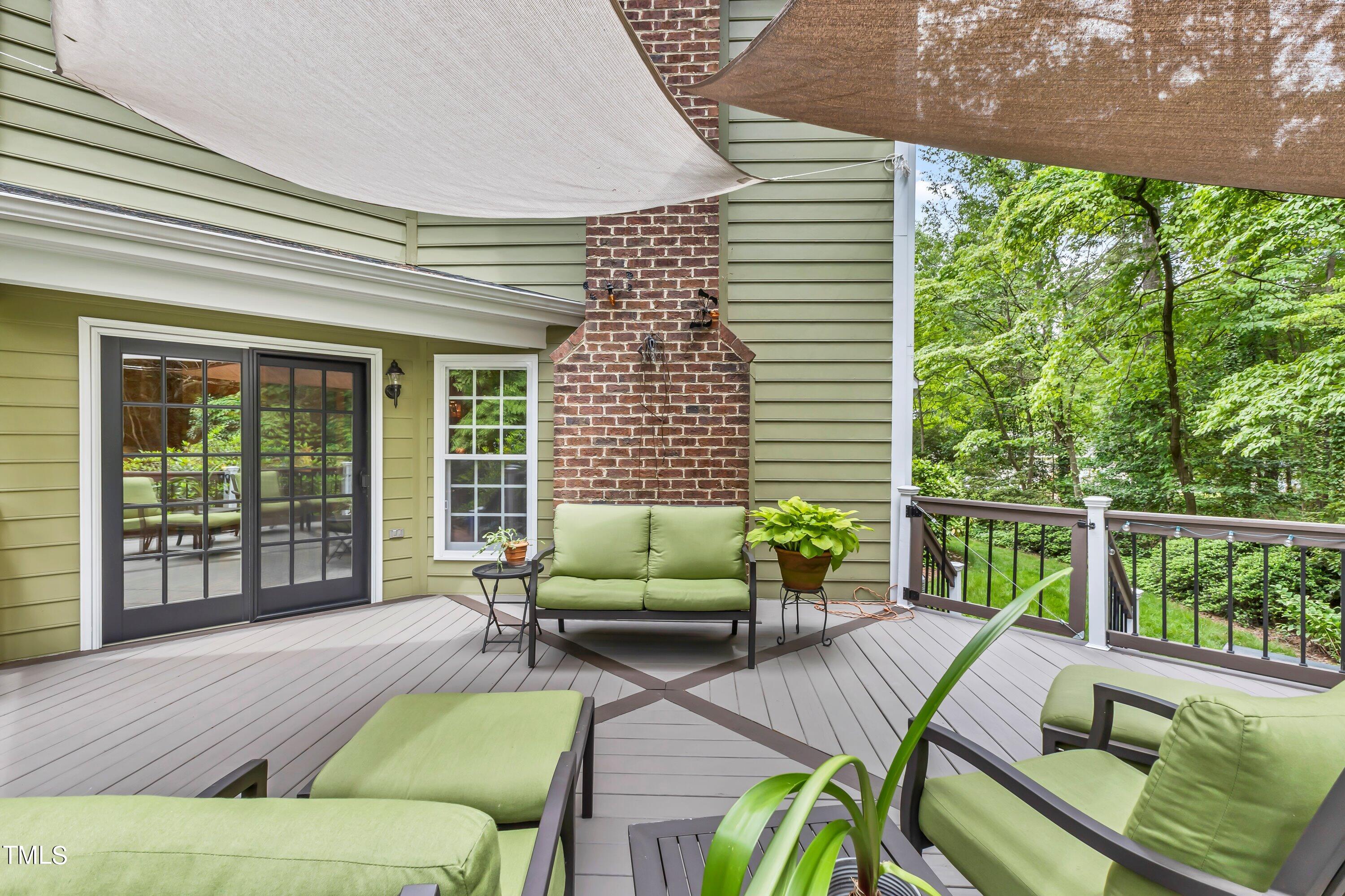 6105 Montcastle Court Raleigh, NC 27612 - Photo 43 of 44 a balcony with furniture and a potted plant