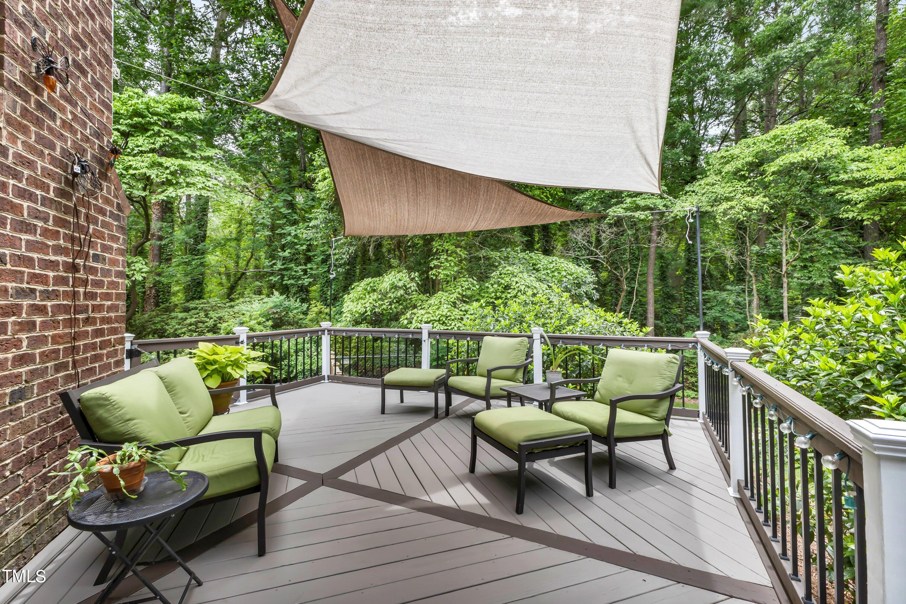 6105 Montcastle Court Raleigh, NC 27612 - Photo 44 of 44 a balcony with wooden floor and outdoor seating