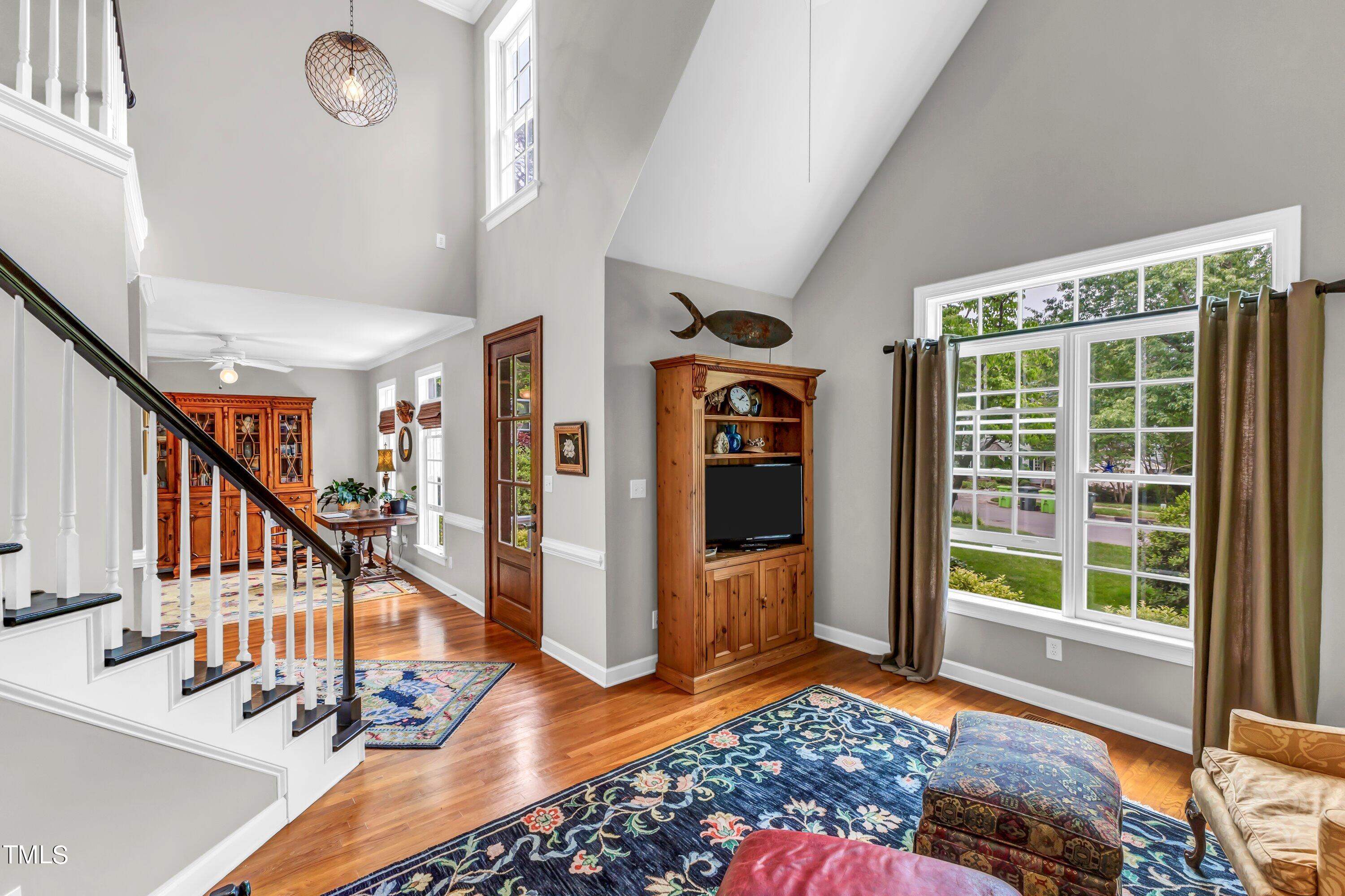 6105 Montcastle Court Raleigh, NC 27612 - Photo 8 of 44 a view of entryway livingroom and hall with wooden floor