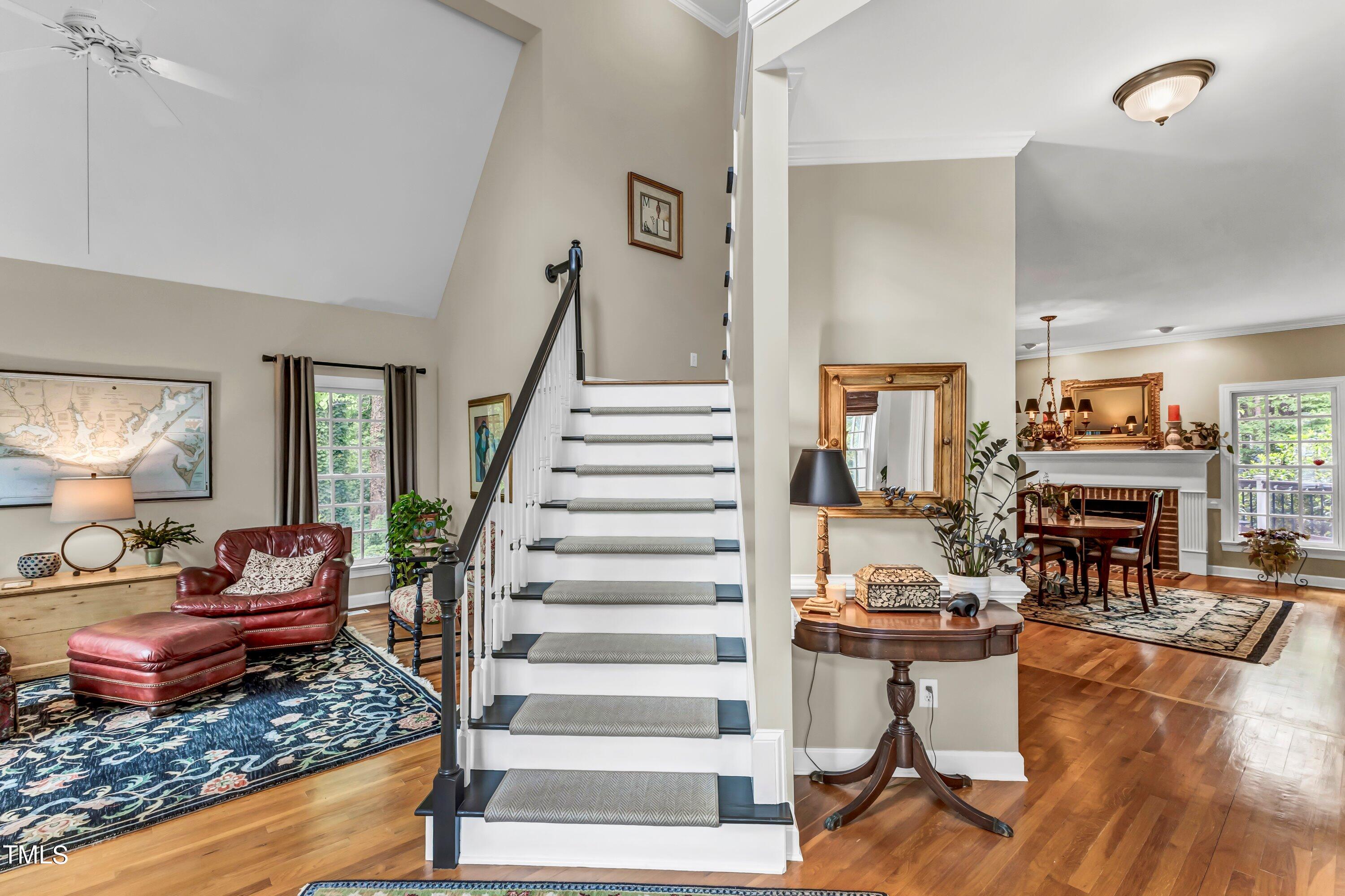 6105 Montcastle Court Raleigh, NC 27612 - Photo 9 of 44 a living room with furniture and a fireplace