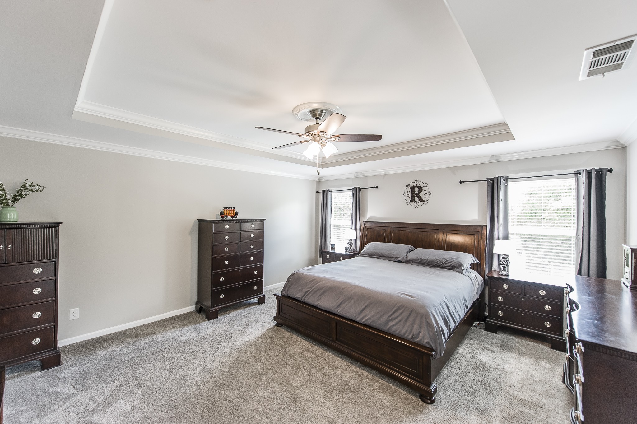 1019 Benwick Road Hendersonville, TN 37075 - Photo 31 of 66 a bedroom with a bed and a chandelier