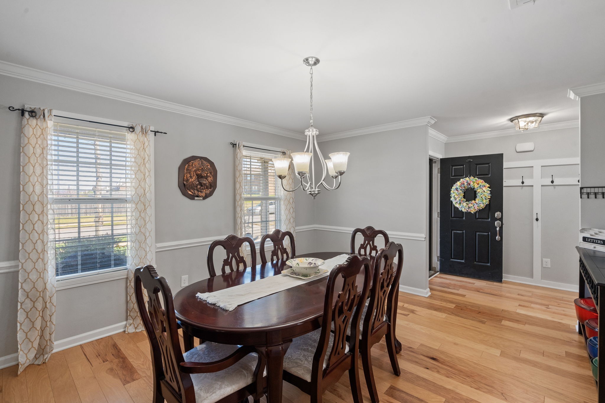 1019 Benwick Road Hendersonville, TN 37075 - Photo 36 of 66 a dining room with furniture a chandelier and wooden floor