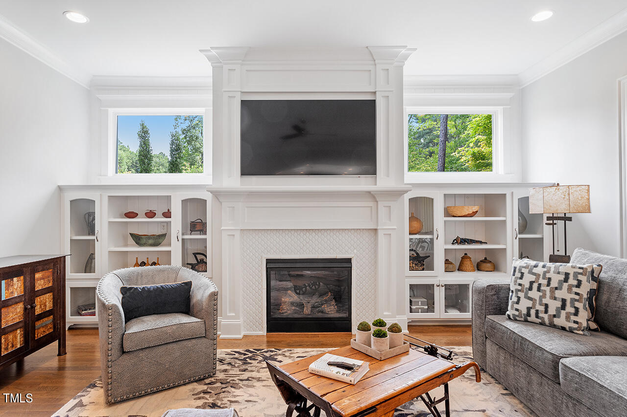 6940 Bartons Bend Way Raleigh, NC 27614 - Photo 14 of 66 a living room with furniture and a fireplace