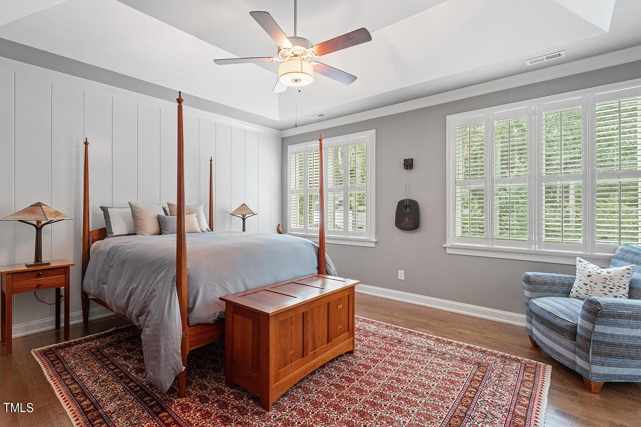 6940 Bartons Bend Way Raleigh, NC 27614 - Photo 29 of 66 a spacious bedroom with a bed a couch and a couch