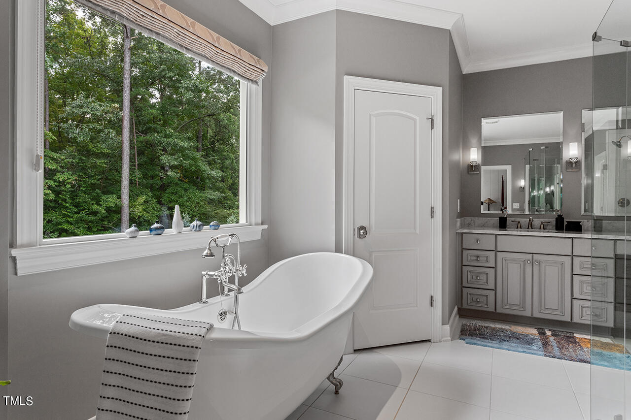 6940 Bartons Bend Way Raleigh, NC 27614 - Photo 32 of 66 a bathroom with a sink and a mirror
