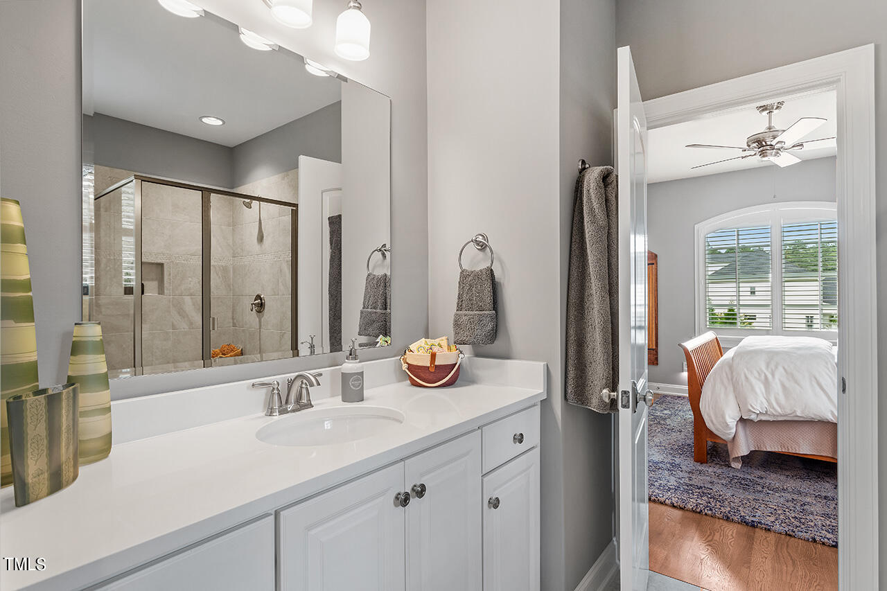 6940 Bartons Bend Way Raleigh, NC 27614 - Photo 35 of 66 a en suite bathroom with double vanity and a mirror