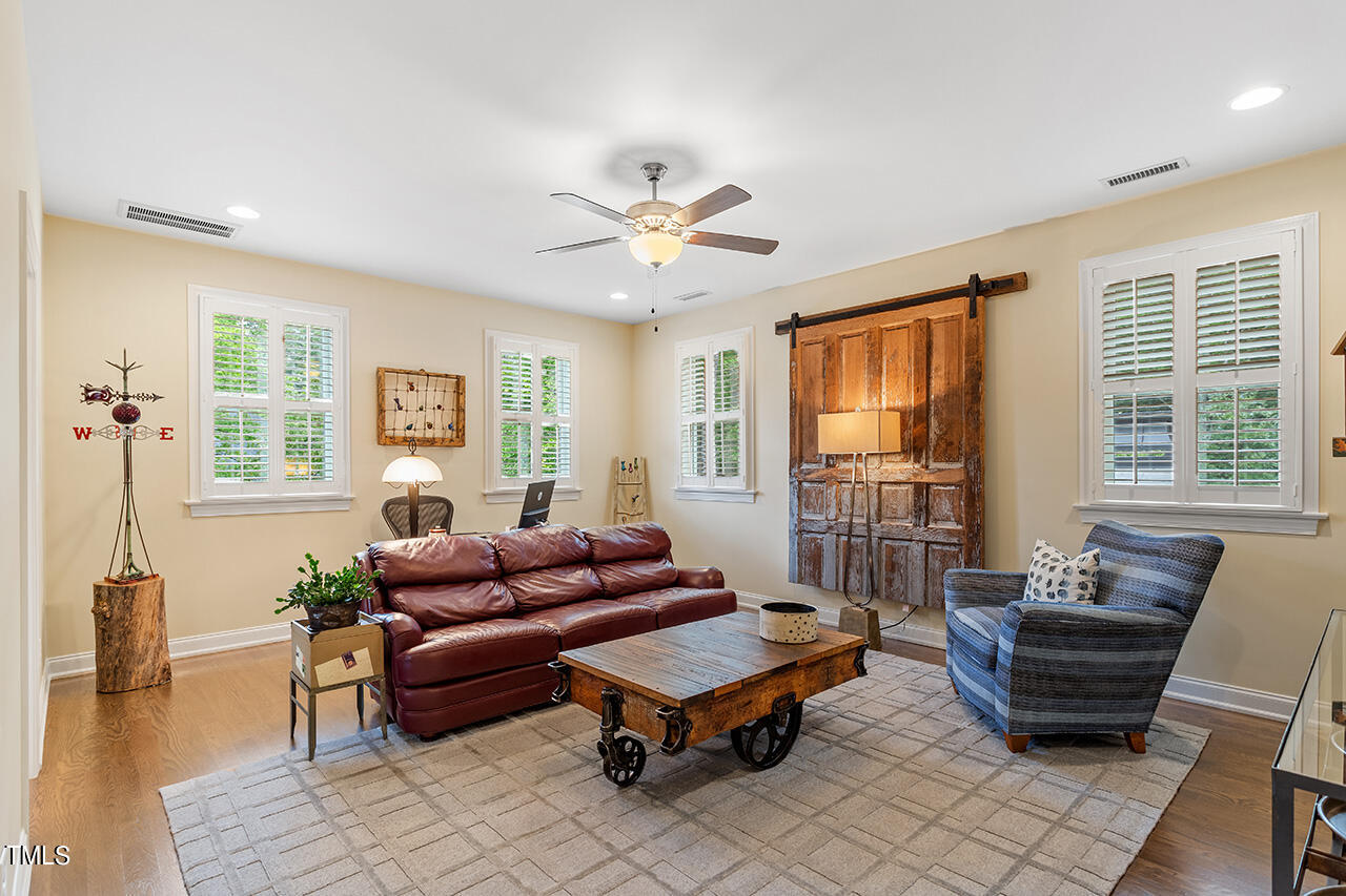 6940 Bartons Bend Way Raleigh, NC 27614 - Photo 45 of 66 a living room with furniture and a window
