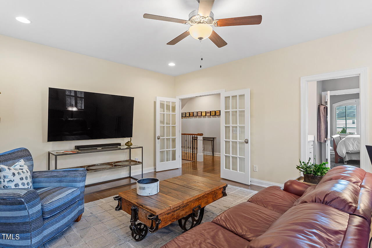 6940 Bartons Bend Way Raleigh, NC 27614 - Photo 46 of 66 a living room with furniture and a flat screen tv
