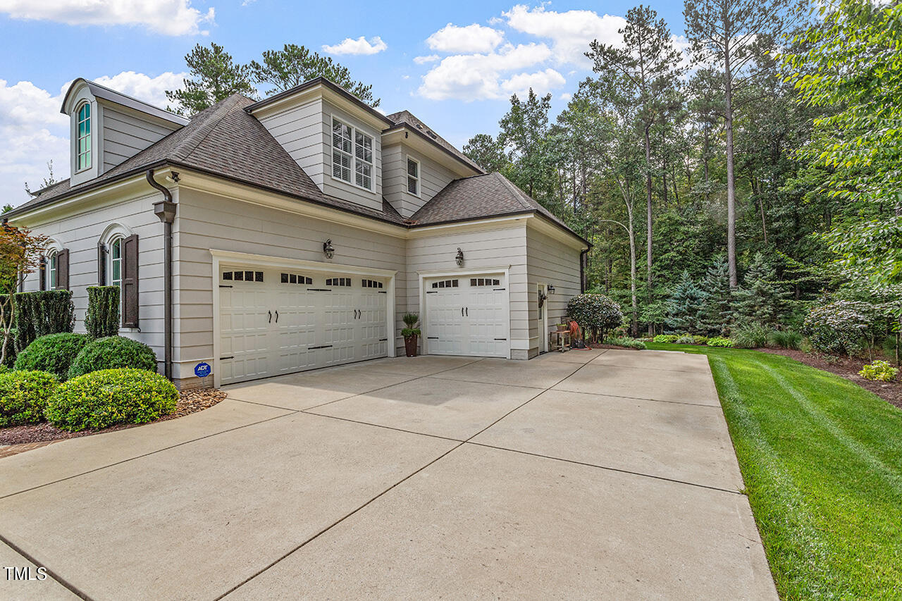 6940 Bartons Bend Way Raleigh, NC 27614 - Photo 62 of 66 a view of a house with a yard